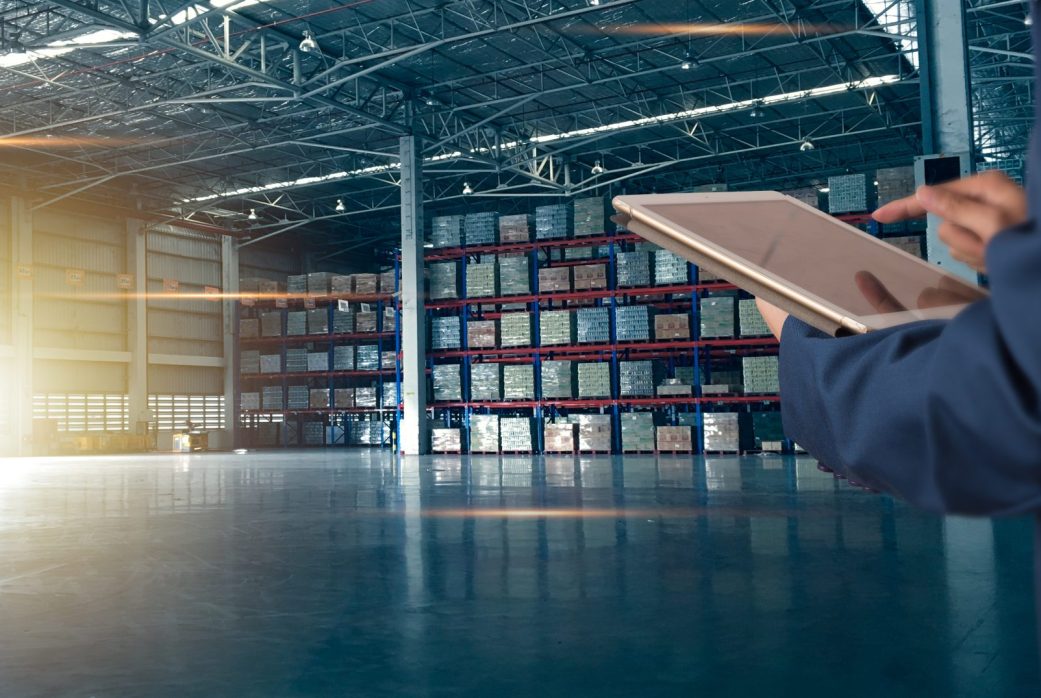 Businessman manager using tablet check and control for workers with Modern Trade warehouse logistics. Industry 5.0 concept Businessman manager using tablet check and control for workers with Modern Trade warehouse logistics. Industry 5.0 concept